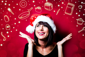 photo of the beautiful young woman in hat looking at the pictures