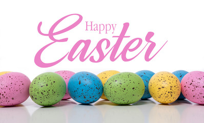 A group of blue Easter Eggs with speckles on a white background