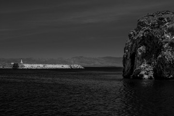A wonderful view  of Hoceima beach and waves and rocks in a sunny day in black and white