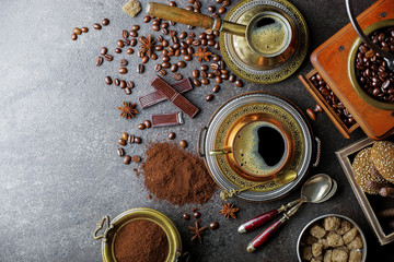 Black coffee in a cup on old background