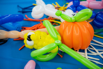 Balloon twisting art children workshop colorful still. Vegetables.