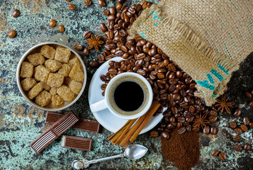 Black coffee in a cup on old background