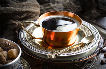 Black coffee on old background