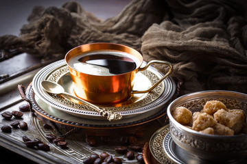 Black coffee in a composition with kitchen accessories