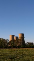 Fototapeta na wymiar cooling towers of power station with blue sky 