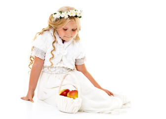 Little girl with a basket of apples.