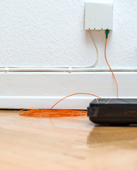 Detail of Fiber optic installation at home with obsolete CATV and new FTTH fiber outlets and...