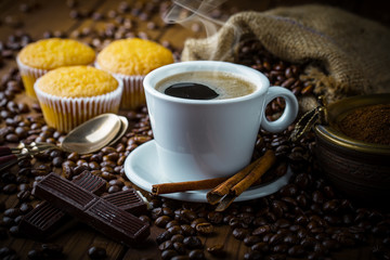 Black coffee in a composition with kitchen accessories