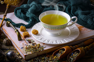 Tea in a cup on an old background