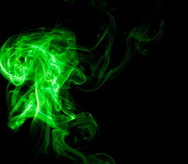 Green smoke on black background