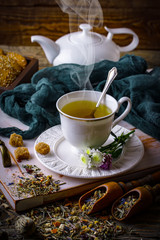 Tea in a cup on an old background