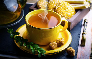 Tea in a cup on an old background