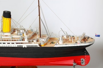 Fototapeta premium Handmade model of Titanic. Beautiful Handmade model of Titanic isolated on white background.