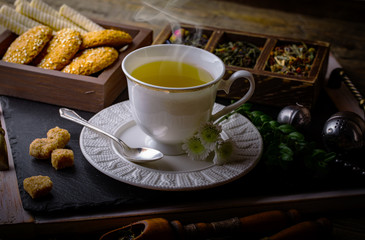 Tea in a cup on an old background