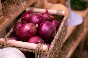 close up onion basket in fresh vegetables store f