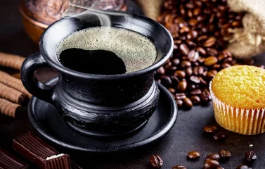 Fotobehang Black coffee in a cup on old background © Karnav