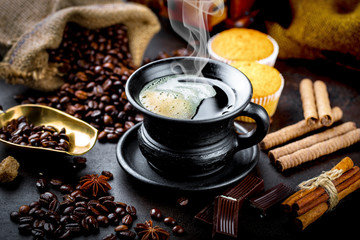 Black coffee in a composition with kitchen accessories