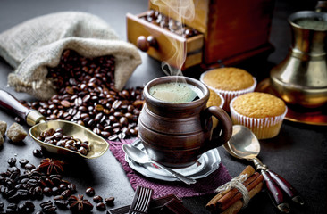 Black coffee in a composition with kitchen accessories