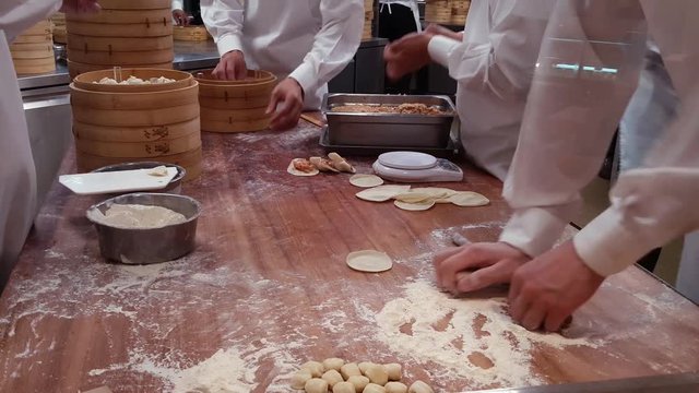 Making Xiao Long Bao Step 4, Stuffing and shaping for making this delicious Chinese dumpling (dim sum)