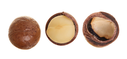 Shelled and unshelled macadamia nuts isolated on white background. Top view. Flat lay pattern