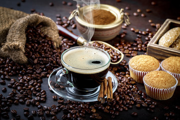 Black coffee in a composition with kitchen accessories