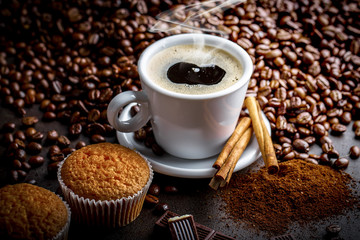Black coffee in a composition with kitchen accessories