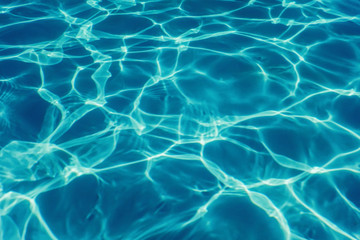 Swimming pool water sun reflection background. Ripple Water.