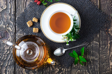 Tea on an old background, in a composition with accessories on the table