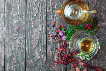 Tea on an old background, in a composition with accessories on the table