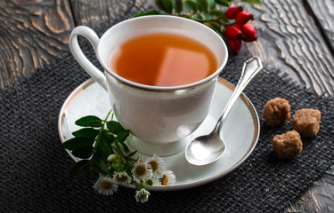 Tea in a cup on an old background