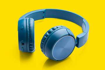 bluetooth blue headphone on yellow