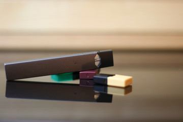 E-Cigerette on Wood background