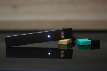 E-Cigerette on Wood background