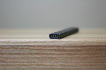 E-Cigerette on Wood background