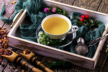 Tea in a cup on an old background