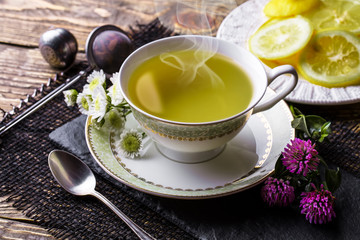 Tea in a cup on an old background