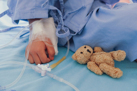 Mother Holding Child's Hand Who Fever Patients In Hospital To Give Encouragement