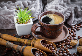 Obraz na płótnie Canvas Black coffee in a cup on old background