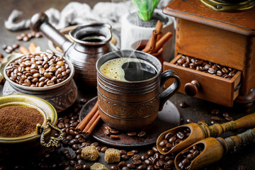 Black coffee in a composition with kitchen accessories