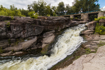 A small rapid at the  middle of Hirsky Tikych river with swallow water in Buky, Cherkasy region, Ukraine