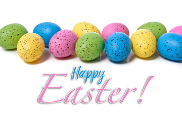 Colorful speckled easter eggs on a white background with greeting