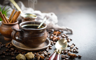 Black coffee in a cup on old background