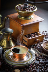 Black coffee in a cup on old background