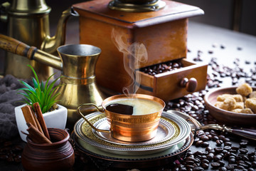 Black coffee in a composition with kitchen accessories