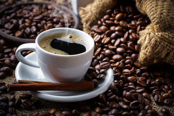 Black coffee in a composition with kitchen accessories