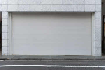 A closeup shot of automatic metal roller door used in factory, storage, garage, and industrial...