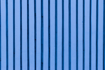Blue fence. Concrete wall texture background. Abstract vertical blue cement wall texture.