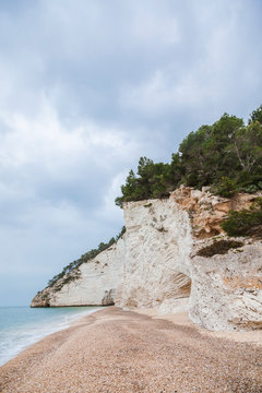Italy, Vieste, empty Vignanotica Beach on a rainy winter day