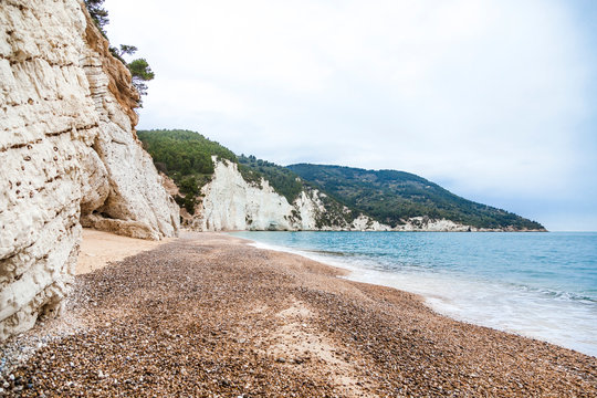 Italy, Vieste, empty Vignanotica Beach on a rainy winter day