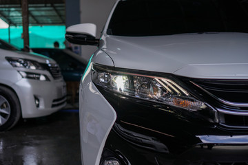 Obraz na płótnie Canvas xenon headlight on a white car